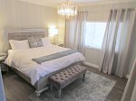 Master bedroom with king size bed and bathroom en suite